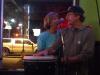 Julie helps Ken with the high harmonies at Johnny’s Wed. Jam.